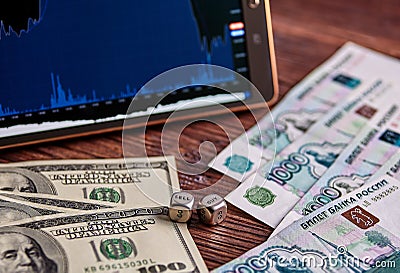 USD, Russian rouble banknotes, dices cubes, financial chart, tab Stock Photo