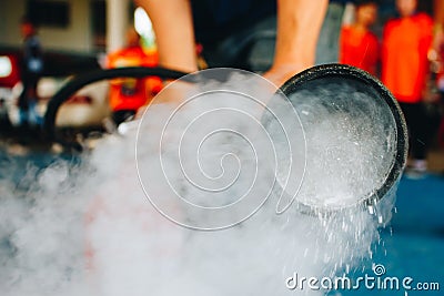 Use a fire extinguisher to fire at the gas tank. Cooking, fireman. Stock Photo