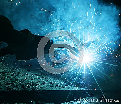 In the use of welding the factory workers Stock Photo