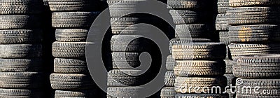 Used auto tires stacked in piles Stock Photo