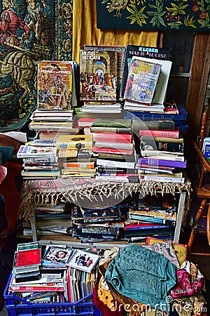 Used books, compact disc and carpets in flea market Editorial Stock Photo