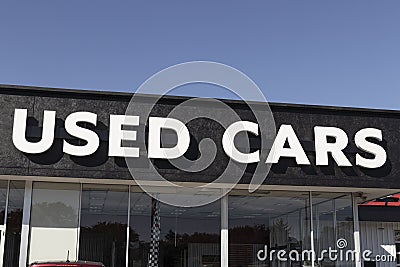 Used Car sign at a pre-owned car dealership. As supplies of new cars dwindle, used cars become more popular Stock Photo