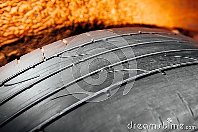 Used car tire with worn-out depth of thread Stock Photo