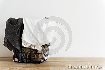 Used clothes in a basket Stock Photo