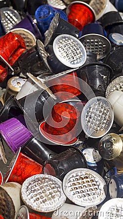 Used coffee capsules of various colors and flavors Stock Photo