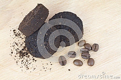 Used coffee grounds after espresso machine and coffee beans Stock Photo