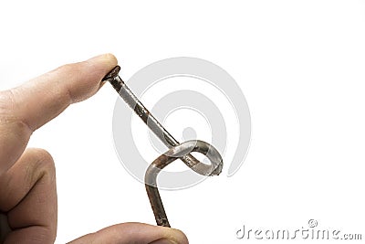 Used crooked rusty nailes on a white. Perseverance and strength Stock Photo