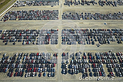 Used damaged cars on auction reseller company big parking lot ready for resale services. Sales of secondhand vehicles Stock Photo