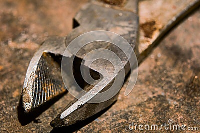 Used diagonal pliers on the metal surface, soft focus Stock Photo