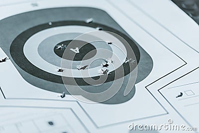 used gun target with holes after bullets Stock Photo