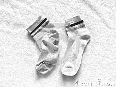 Used and new socks isolated on softness white cotton background Stock Photo