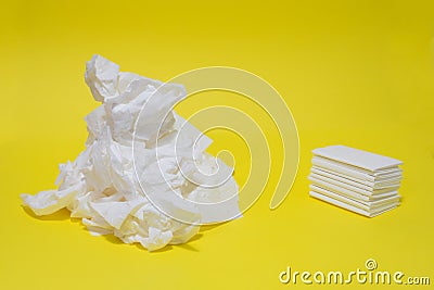 Used and new tissues on yellow background. Concept of sickness, flu and cold, crying, untidy, masturbation. Stock Photo