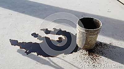 Used oil spill is on the floor. Stock Photo