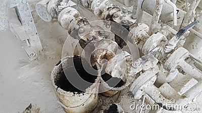 The used oil spill from a white bucket on the floor Stock Photo