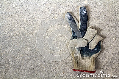 Used old dirty torn worker& x27;s gloves as a metaphor, concept or sy Stock Photo