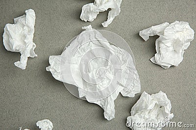 Used paper tissues on grey background Stock Photo