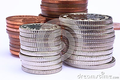 Used Silver and Copper Coins Stacked Stock Photo