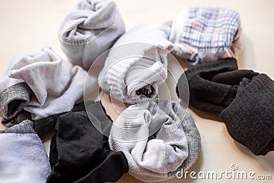 Used socks on wood background Stock Photo