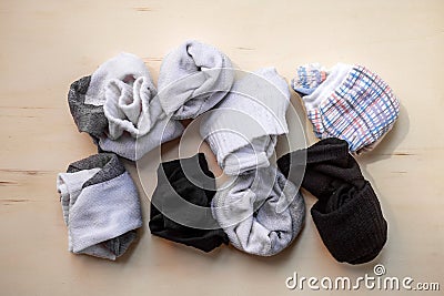 Used socks on wood background Stock Photo