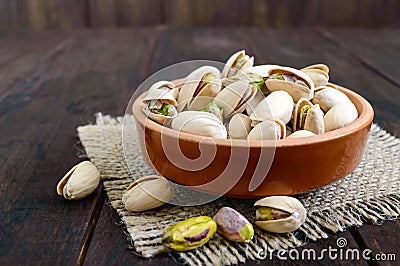 Useful nuts - pistachios in a ceramic bowl Stock Photo