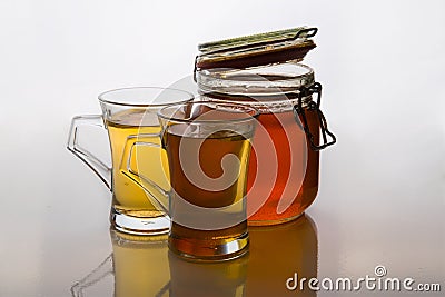 Green tea in glass cups with honey and lemon on white background with mint Stock Photo