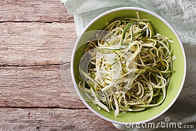 Useful raw zucchini pasta in a bowl close up. horizontal top vie Stock Photo