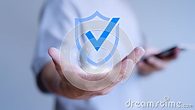 User hand show the warranty identity proof icon for security protection system on virtual screen. Stock Photo