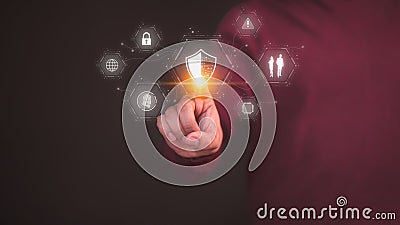 User hand touch the shield security icon for security protection system on virtual screen. Stock Photo