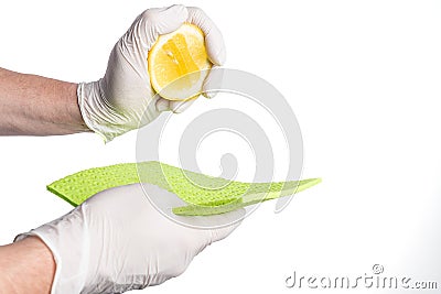 Using biological lemon cleaning agents and gloves Stock Photo