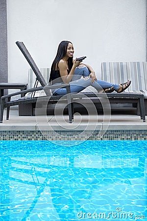 Using Cell Phone to Dictate Reminders While on Vacation Stock Photo