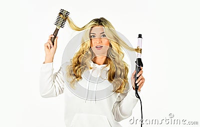 Using different wrapping techniques. Choose right type curling iron for your needs. Girl adorable blonde. Online shop Stock Photo