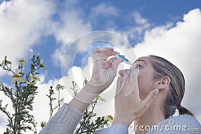 Using eyedropper to treat irritated eyes Stock Photo