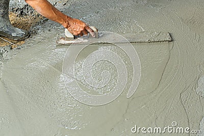 Using float to level surface of concrete Stock Photo