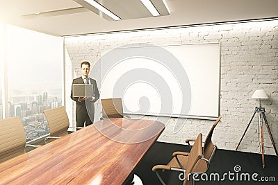 Using laptop in conference room Stock Photo