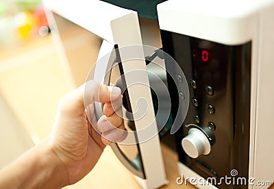 Using microwave oven Stock Photo