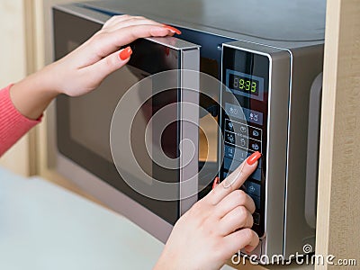 Using microwave oven Stock Photo