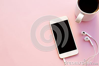 Using mobile phone holding coffee cup. Stock Photo