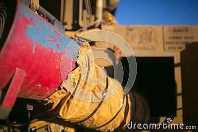 Using safety exhausting ventilation system fan inside the confined spaces while commencing welding hot work Stock Photo