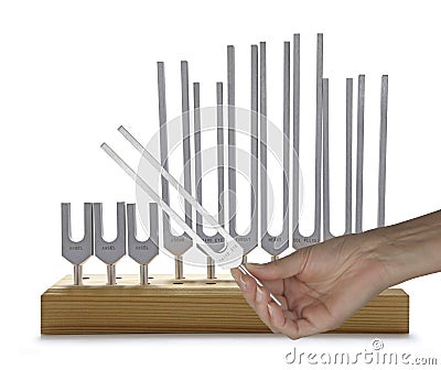 Using Sound Healing Tuning Forks Stock Photo