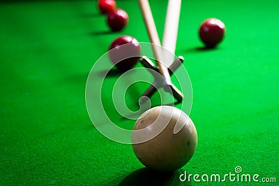 Using a spider to take a long shot in billiards Stock Photo