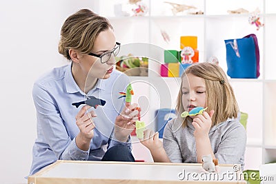 Using toys during play therapy Stock Photo