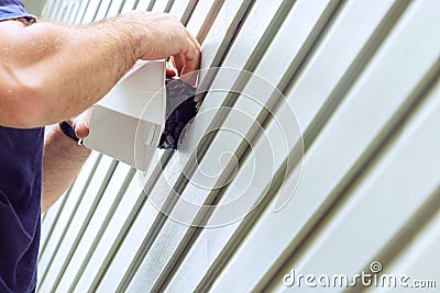 Using a universal vent cap exhaust fan to install ventilation system Stock Photo