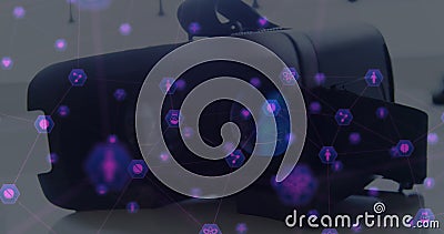 Using virtual reality headset, person exploring digital interface icons, showcasing innovation Stock Photo