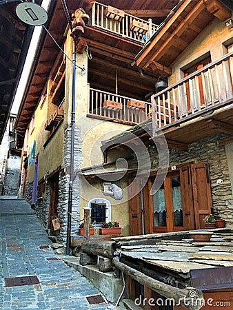 Usseaux village in Piedmont region, Italy. Narrow splendid street, mountain and peace Stock Photo