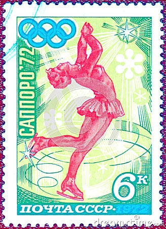 Postage stamp printed in the USSR with the image of a figure skater and the inscription in Russian `Sapporo, 72` Editorial Stock Photo