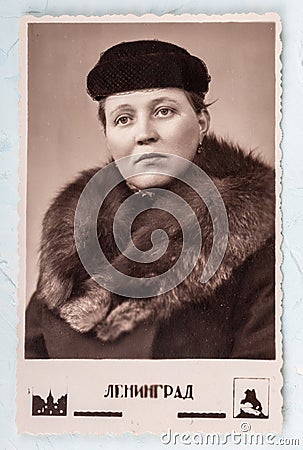 USSR - circa 1960s: studio portrait of a woman in a coat with a fur collar. Editorial Stock Photo