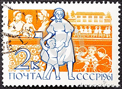 USSR - CIRCA 1961: A stamp printed in USSR shows teacher and child, children in kindergarten without inscription, from Editorial Stock Photo