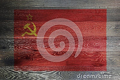 USSR flag on rustic old wood surface red yellow hammer sickle CCCP Stock Photo