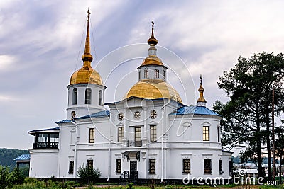 Ust-Kuda, Russia - 24 June 2020: Russian rural landscape with Church of Kazan icon of mother of God Editorial Stock Photo