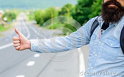 Usually use thumb up to inform drivers hitchhiking. But in some cultures gesture offensive so you risk to be killed by Stock Photo